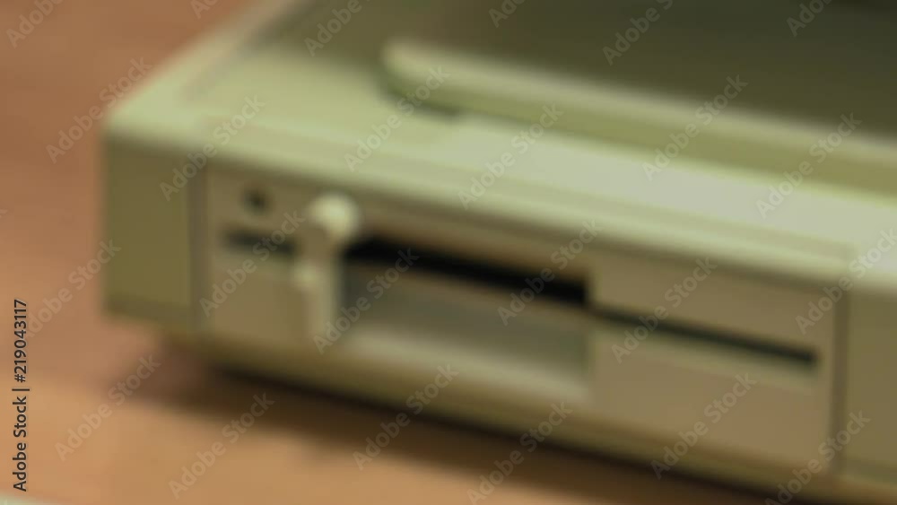 Floppy Disk Drive. Computer or game console from the 90s. Old retro style. , Panning, closeup. Floppy Disk Drive. Computer or game console from the 90s. Old retro style. , Panning, closeup.