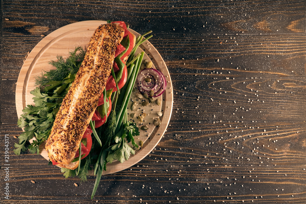 fresh sandwich with salami, tomato, greenery and onion; fresh sandwich with salami, tomato, greenery and onion;