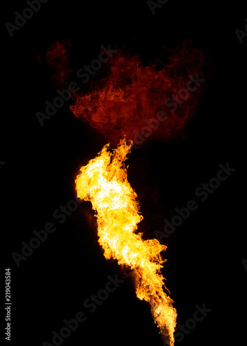 Bright isolated fire stream with red flame cloud on top