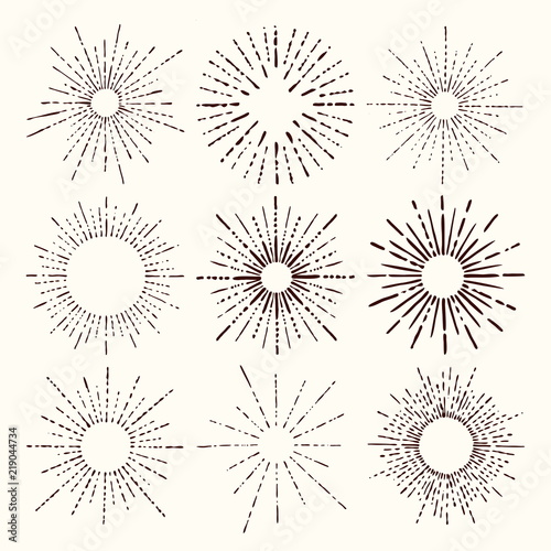 Set and collection of trendy hand drawn retro sunburst/bursting rays design elements.