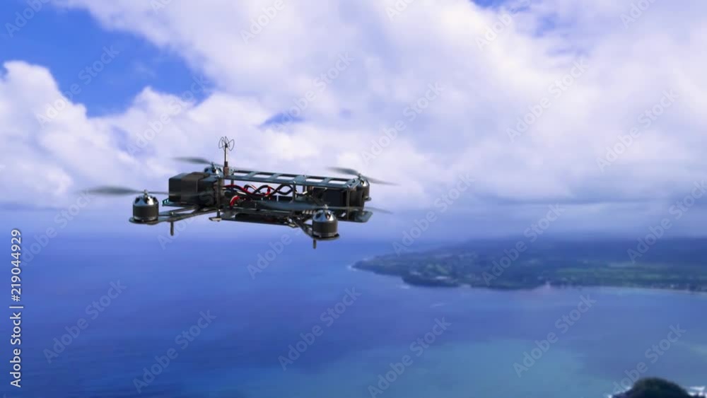 An aerial view of a racing drone flies above a tropical island. An aerial view of a racing drone flies above a tropical island.