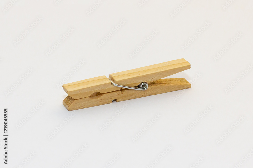 Isolated wooden clothes peg on a white background Isolated wooden clothes peg on a white background