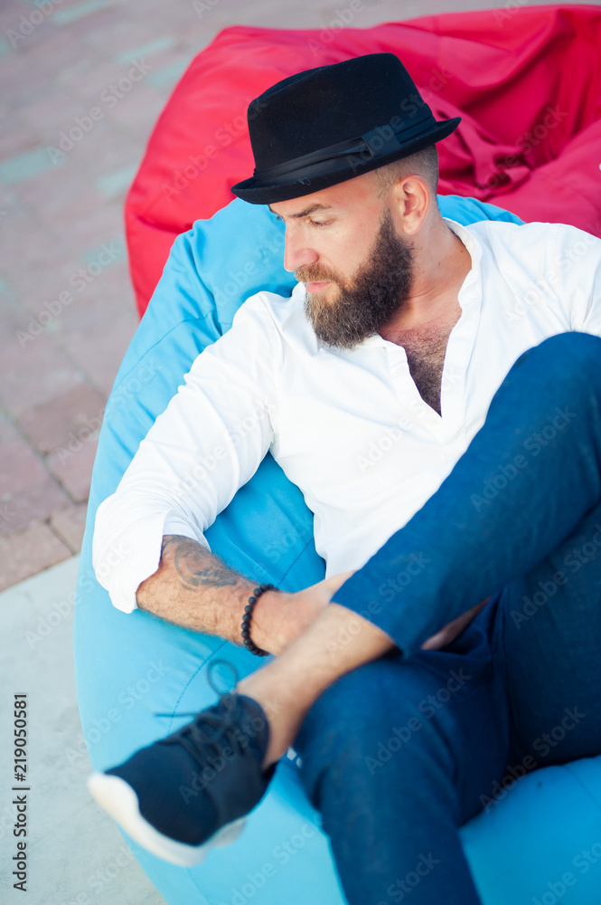 Stylish bearded man in hats. Men's Style.