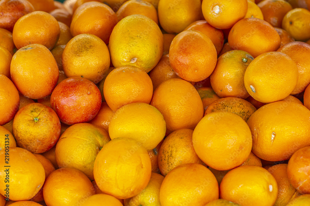 Fresh ripe overflowing box of oranges ready for eating Fresh ripe overflowing box of oranges ready for eating