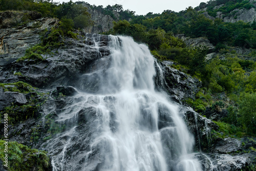 Beautiful high waterfall in swiss Alps, summer