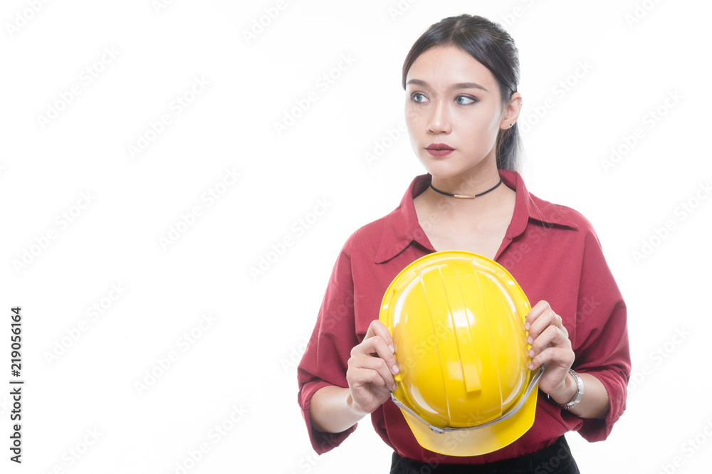 Engineering woman in red shirt with yellow safety helmet in Studio light, occupation concept. Engineering woman in red shirt with yellow safety helmet in Studio light, occupation concept.