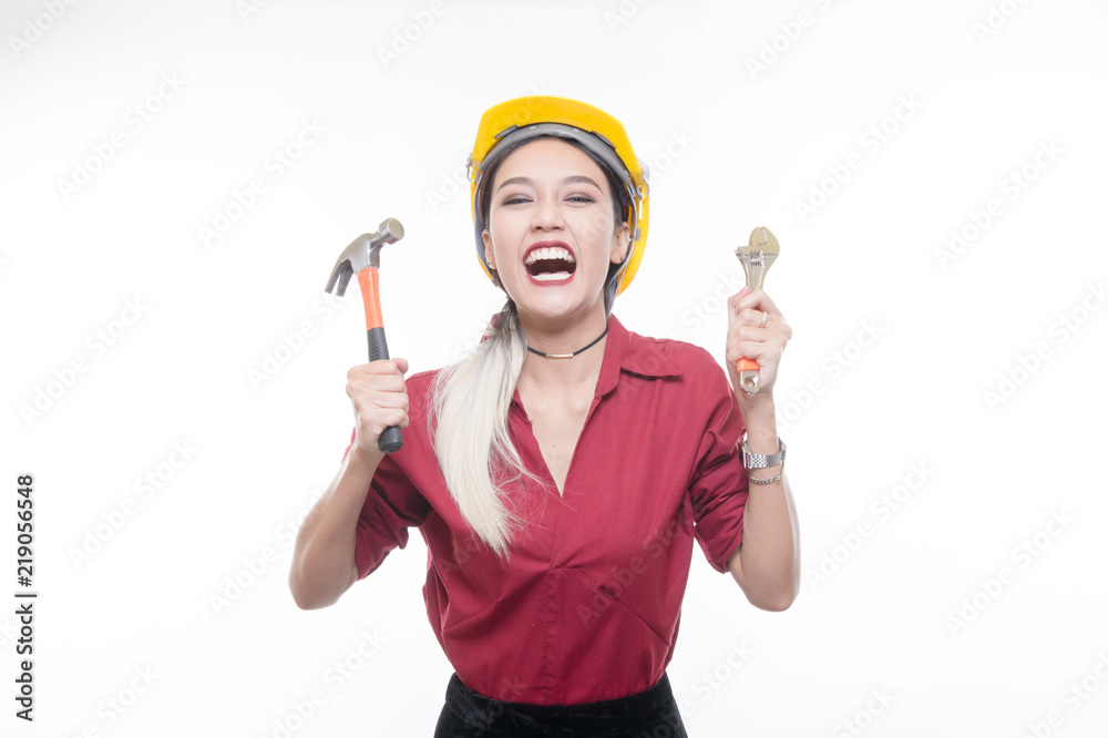 Beautiful engineering woman using hammer and tools in white background , Occupation concept, Studio light portrait. Beautiful engineering woman using hammer and tools in white background , Occupation concept, Studio light portrait.
