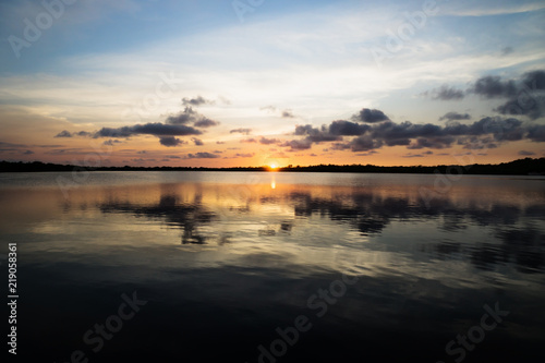 Sunset with fluffy clouds at the lagoon in Utila  Honduras  Central America