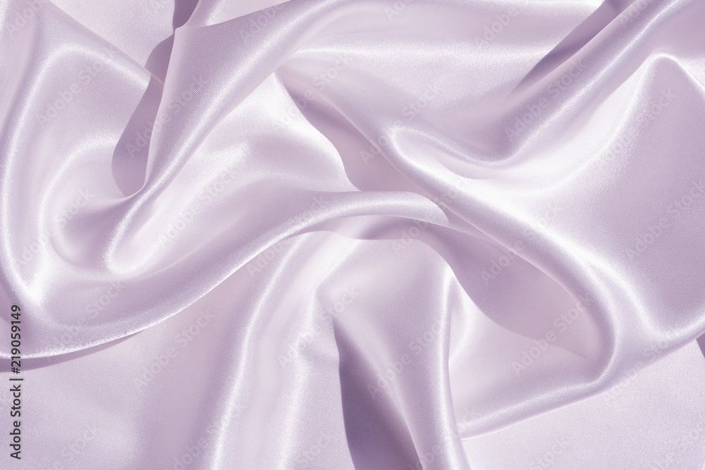 Fototapeta premium The texture of the satin fabric of lilac color for the background