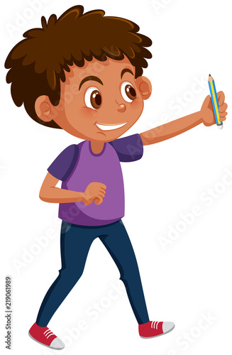 young boy holding pencil photo