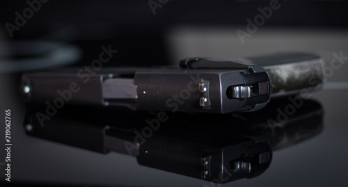 Handgun isolated on black. Arms control. Close up