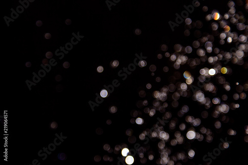 bokeh of water drops levitating in the air reflection