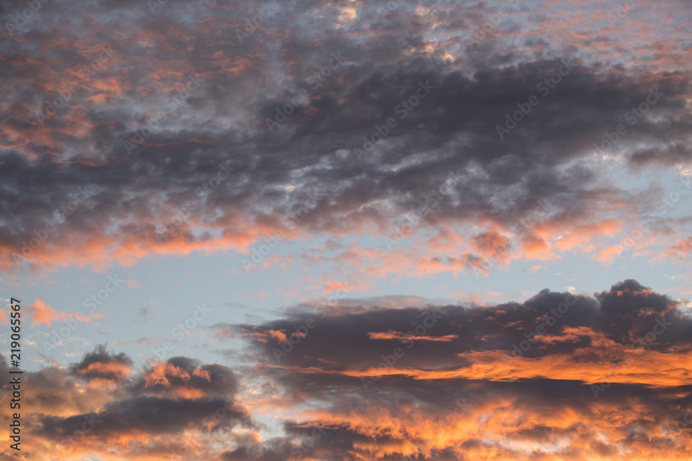 Fototapeta premium Beautiful sunset sky above clouds