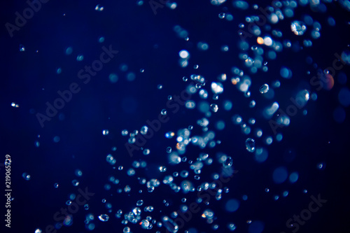 defocus bokeh of water drop on blue