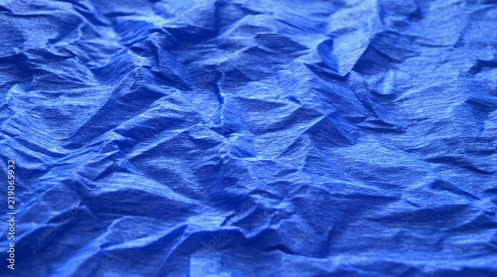 Bright blue background of crumpled paper Bright blue background of crumpled paper