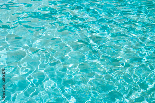 Blue sea water or water in the pool close-up, texture, background