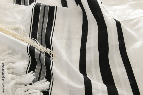 White Prayer Shawl - Tallit, jewish religious symbol. photo