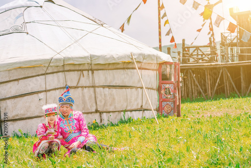 Mother and daughter playing in front of the yurt photo