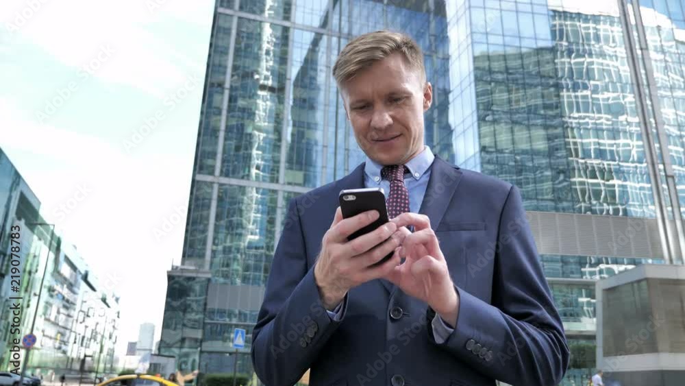 Businessman Broswing internet on Smartphone Businessman Broswing internet on Smartphone