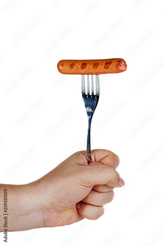 Hand hold grilled sausage on fork Hand hold grilled sausage on fork