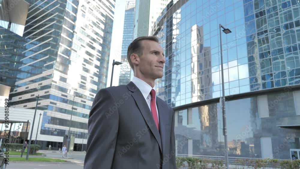 Middle Aged Businessman Standing Outside Office Middle Aged Businessman Standing Outside Office
