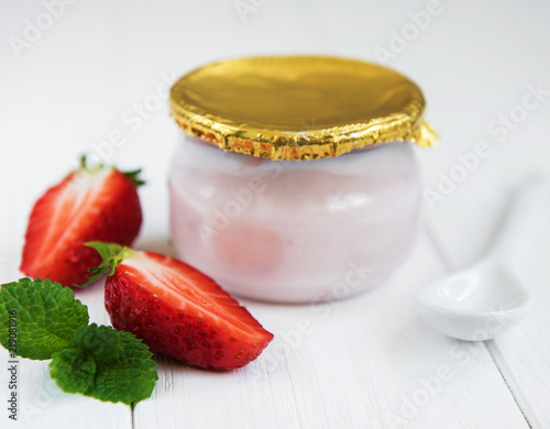 Jar with strawberry yogurt