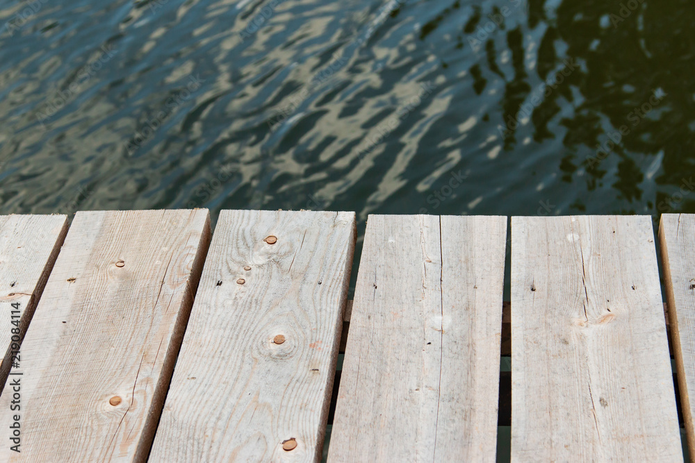 wooden planks on the background of water wooden planks on the background of water