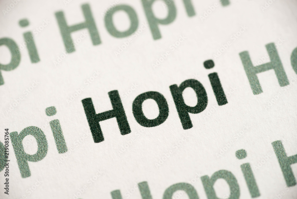 Fototapeta premium word Hopi language printed on paper macro