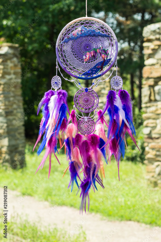 Obraz premium Handmade dream catcher with feathers threads and beads rope hanging