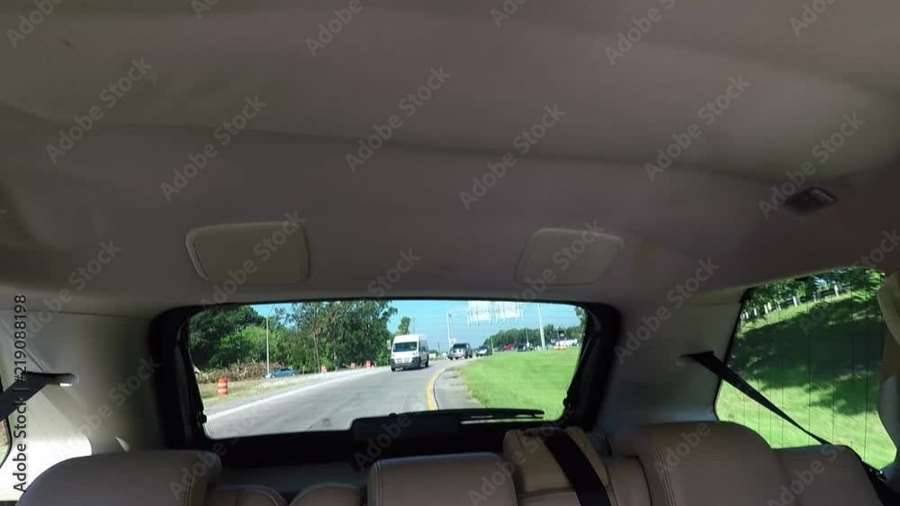 Looking out through back window of SUV while drive in Atlanta but could be anywhere. Looking out through back window of SUV while drive in Atlanta but could be anywhere.