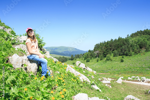 teen girl on a hike in the mountains
