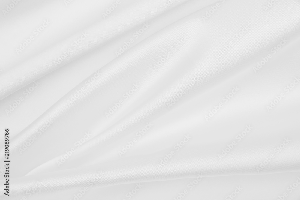 Smooth elegant white silk or satin luxury cloth texture as wedding background. Luxurious background design Smooth elegant white silk or satin luxury cloth texture as wedding background. Luxurious background design