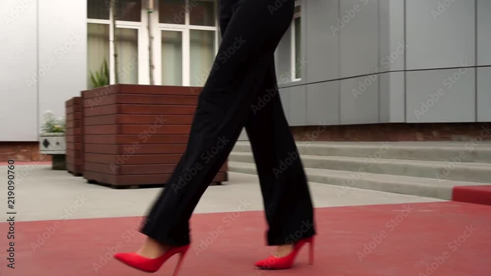 Beautiful young business woman walking outside on the stairs. Close up of legs Beautiful young business woman walking outside on the stairs. Close up of legs