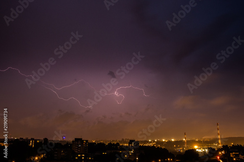 Lightning strike with purple sky over Vilnius city in Lithuania
