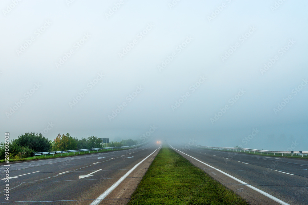 picturesque view of roadway on hill at sunset 
