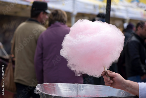 Cotton candy being made out of pink dyed sugar for joyful children. Concept of unhealthy eating, too much sugar. Diabetes.  
