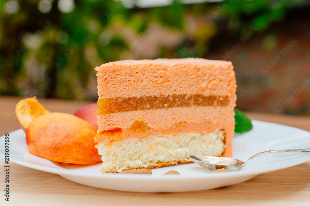 Pie with peach souffle. A piece of peach pie with a souffle on a plate. Pie with peach souffle. A piece of peach pie with a souffle on a plate.