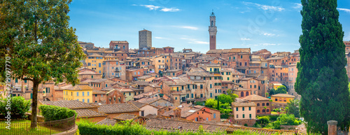 A view of the old city and the towering cathedral in one of the most beautiful cities of Tuscany Siena. Italy. Europe photo