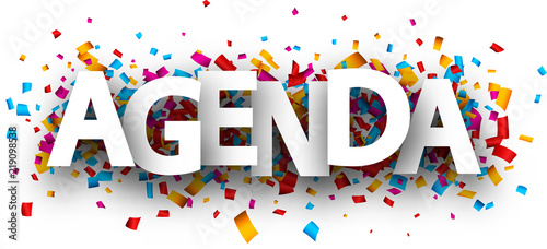 Agenda sign with colorful confetti.