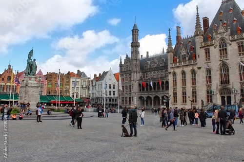 bruges market markt square with tourists in autumn