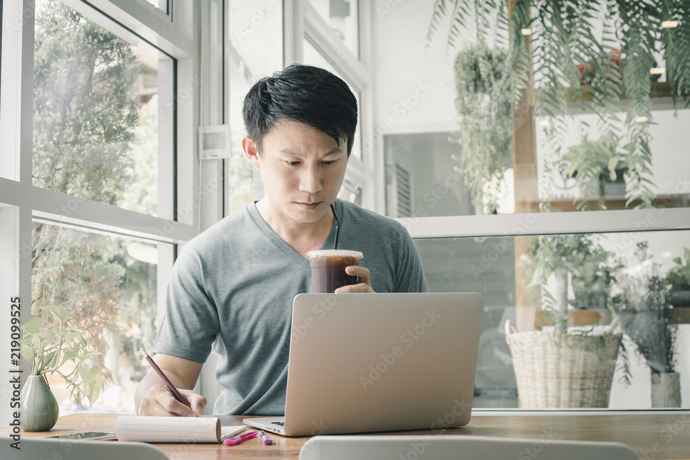 Freelancer man working online at his home.
Freelancer man working online at his home.