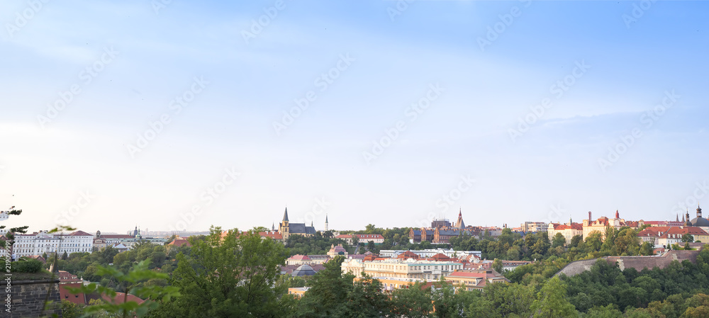 Panorama of Prague and view onto bridges over river Vltava and traditional red roofs in old town of Prague