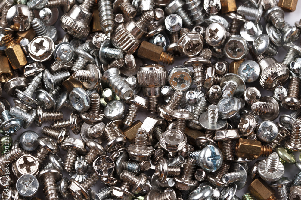Background of many randomly scattered screws Background of many randomly scattered screws