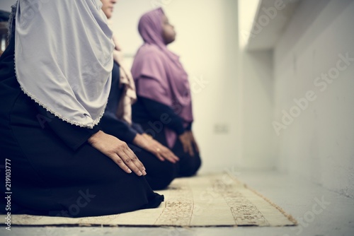 Muslim people praying in the room photo