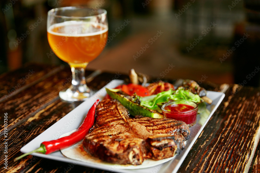 Steak And Beer. Barbecue Meat With Grill Vegetables And Beer Steak And Beer. Barbecue Meat With Grill Vegetables And Beer