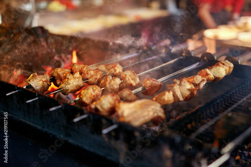Grilling Meat On Skewers. Barbecue Meat Pieces Cooking On Grill