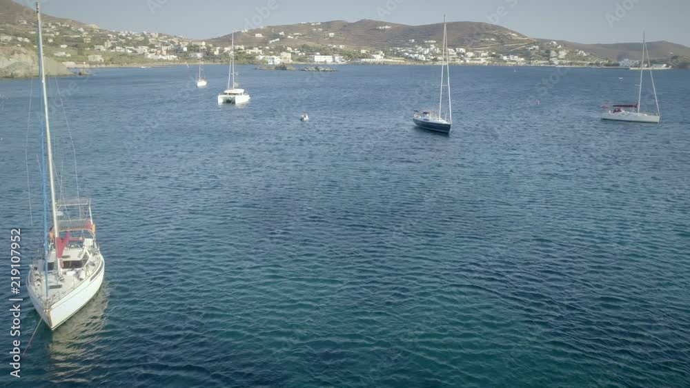 Aerial view of sailboats sailing cross blue and clean sea in Greece. Aerial view of sailboats sailing cross blue and clean sea in Greece.