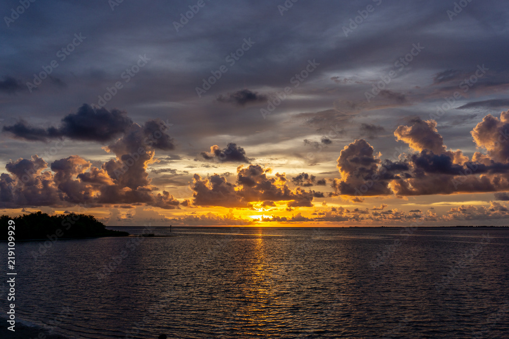 A beautiful Florida gulf coast sunset after an evening thunderstorm has passed through the area. Fort Island Gulf Beach, in Florida's Citrus County, is a popular spot to view these sunsets.