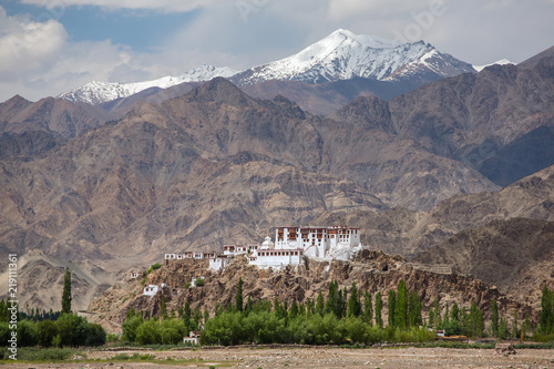 Stakna gompa temple ( buddhist monastery ) with a view of Himalaya mountains in Leh, Ladakh, Jammu and Kashmir, India. photo