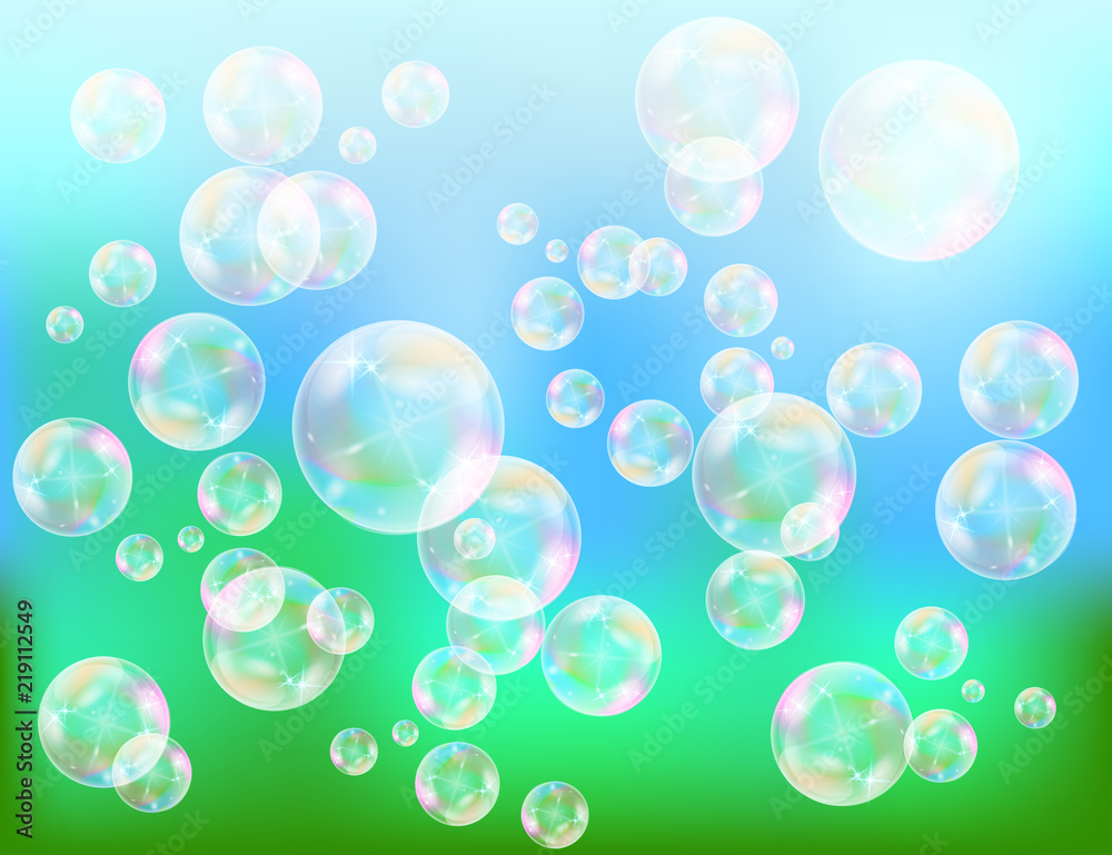 Realistic soap bubbles with rainbow reflection set isolated on the blue sparkling background